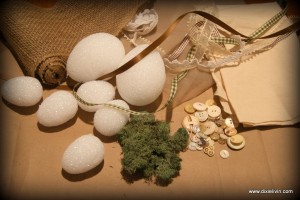 Styrofoam eggs, ribbons, buttons and moss